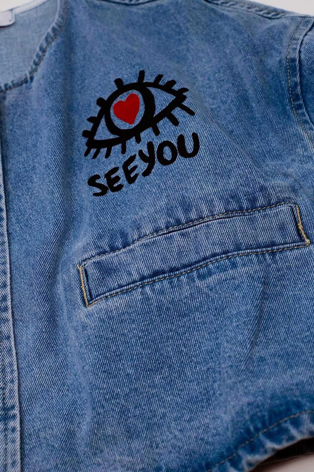 CROPPED DENIM JACKET WITH HAND PAINTED PRINT