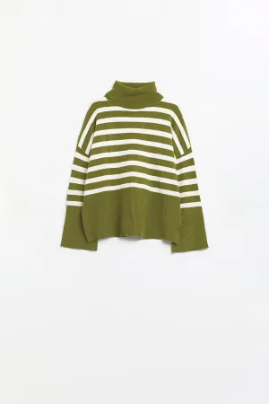 Green oversized trutleneck sweater with white stripes and splits on the side