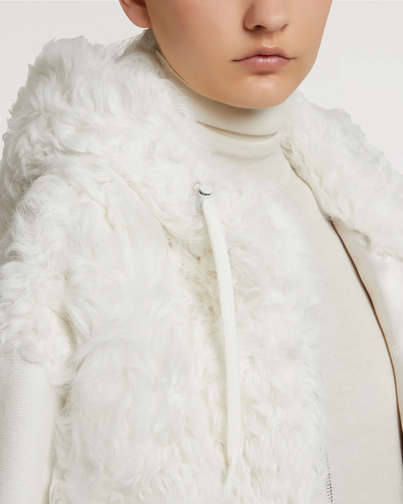 Hooded jacket in knit and curly lamb