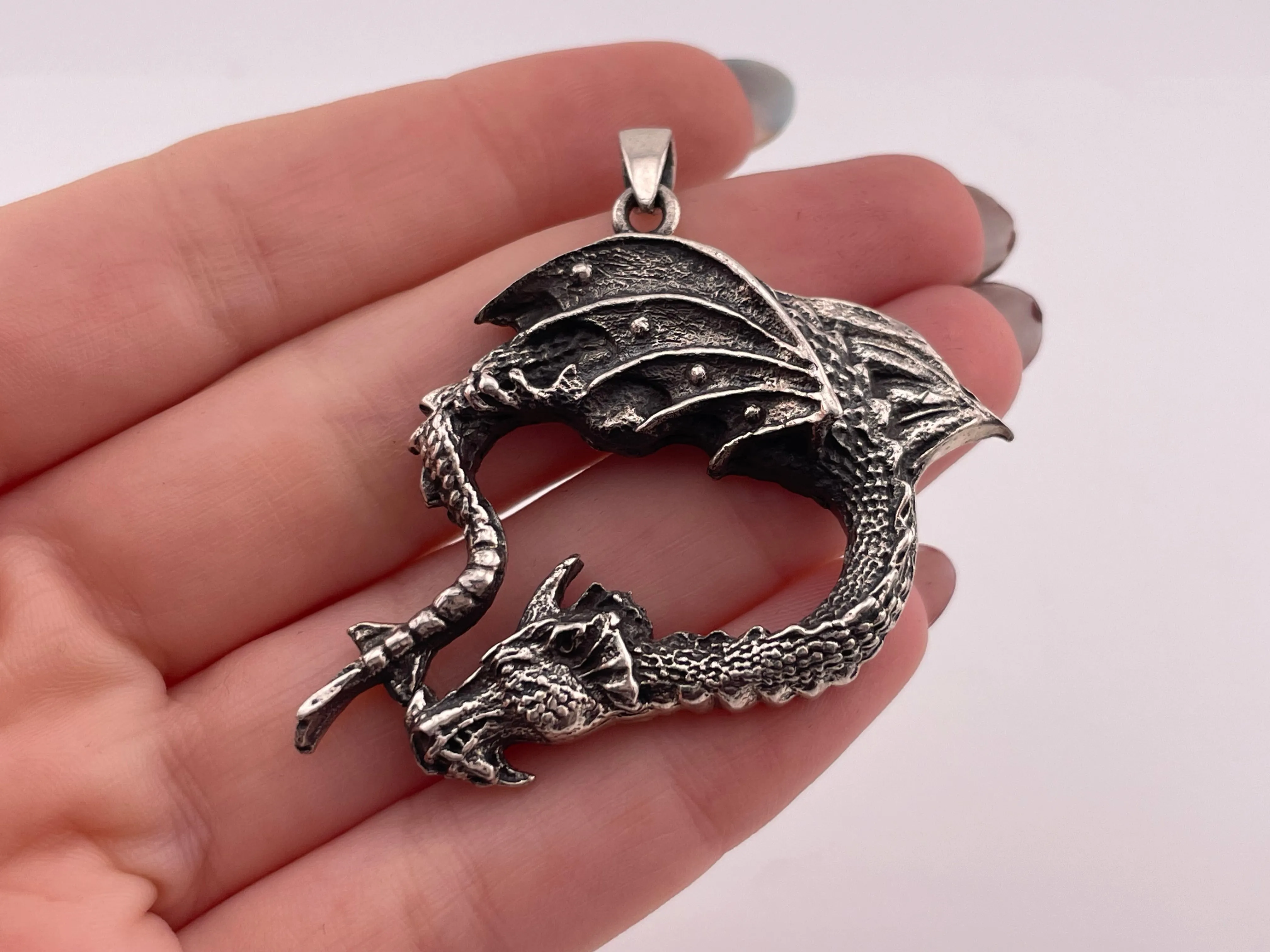 sterling silver bending dragon pendant